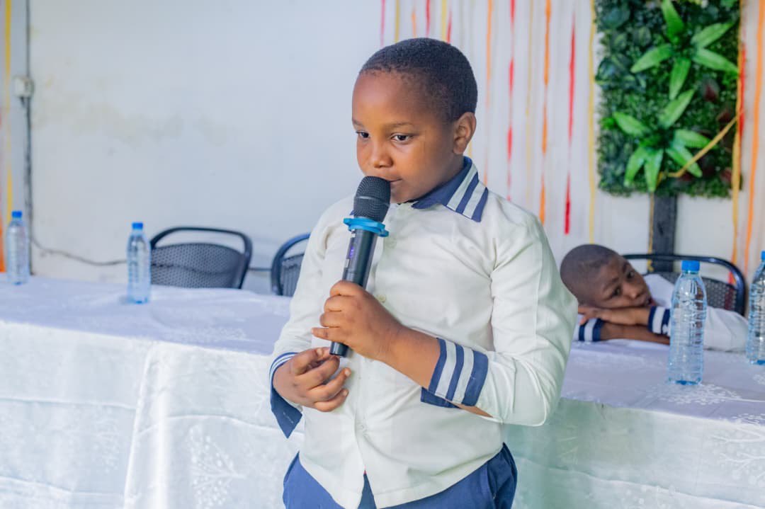 Students performing a presentation on stage